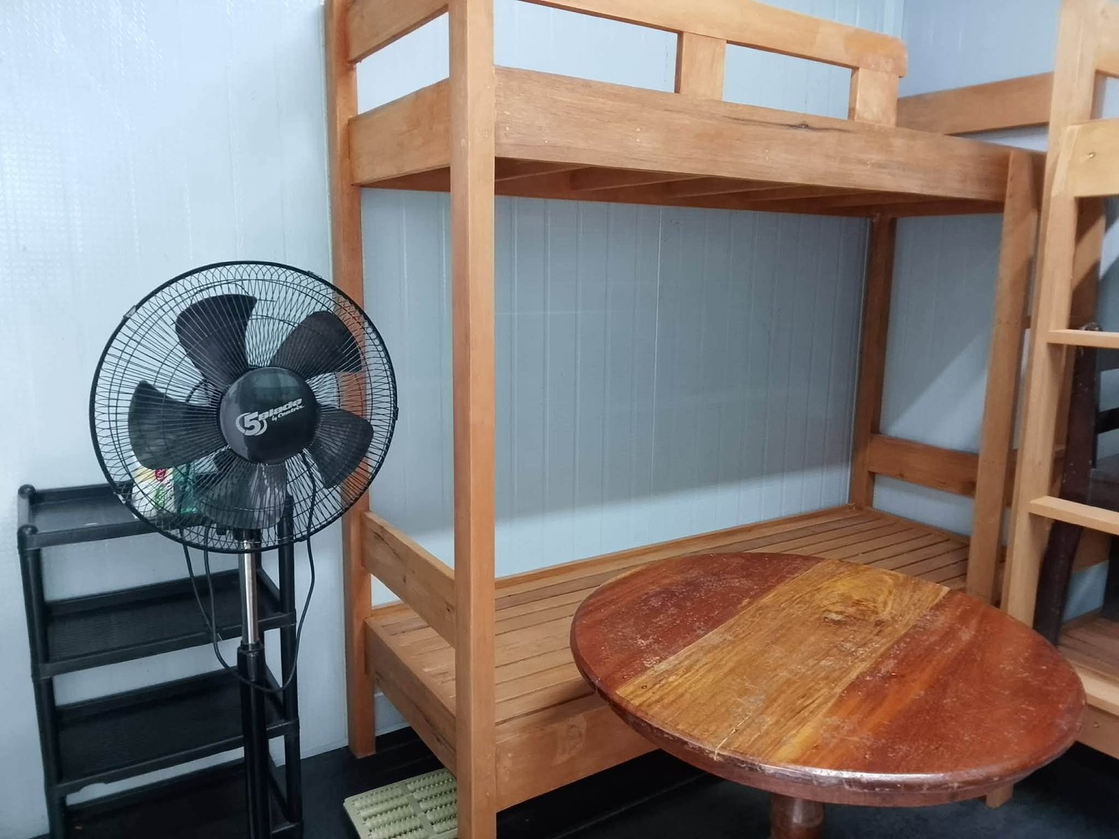 Bunk beds and electric fan at Brooksides Space